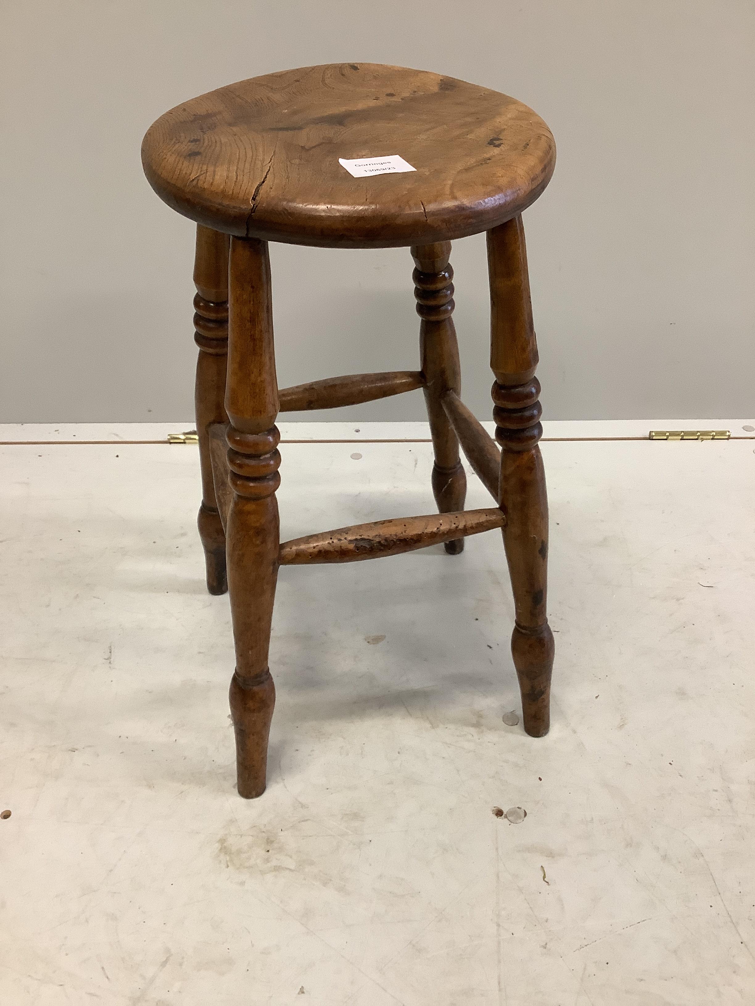 A Victorian provincial elm and fruitwood stool, height 54cm